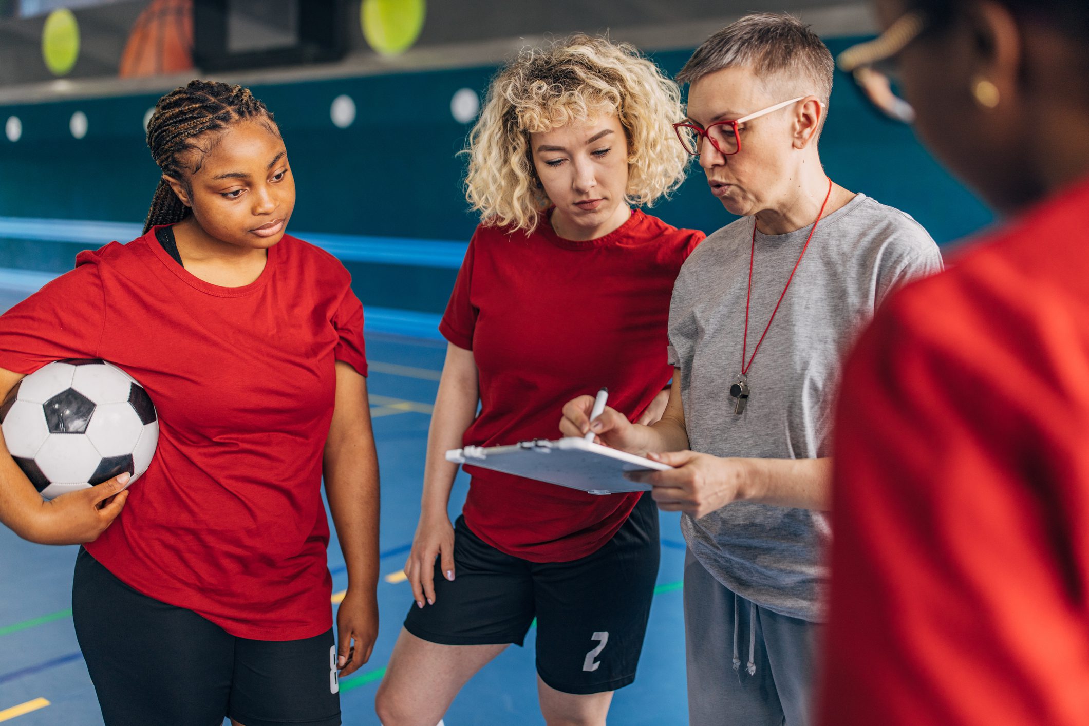 Team meeting on indoor soccer court